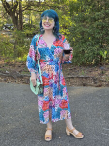 Jamie in a colorful dress at a wedding