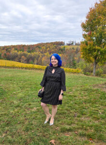 Jamie in a velvet dress in the mountains